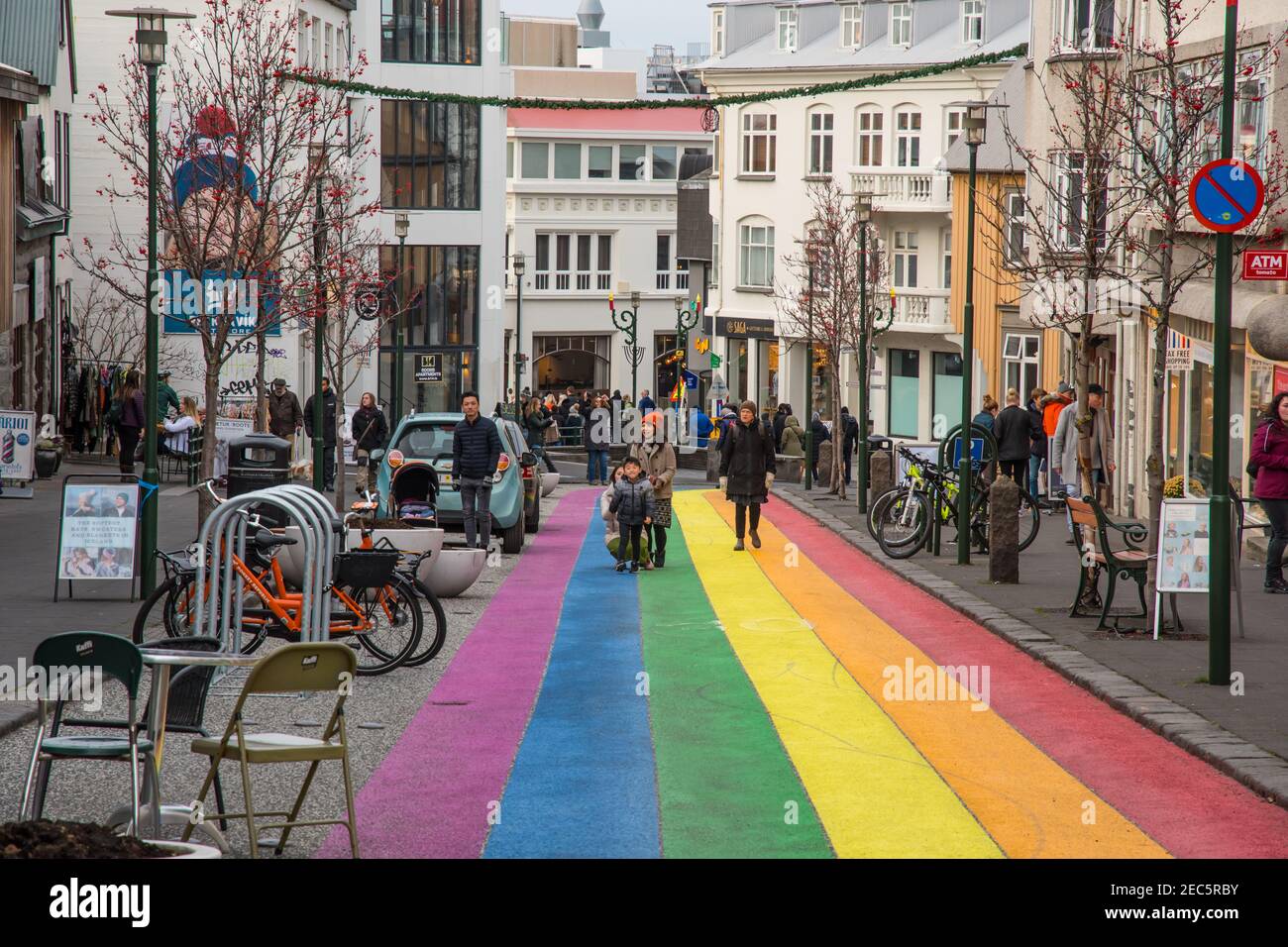 Reykjavik Iceland - November 2. 2019: People walking on the rainbow painted Skolavordustigur street Stock Photo