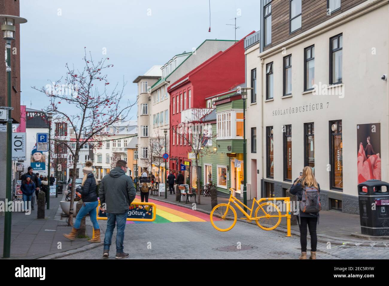 Reykjavik Iceland - November 2. 2019: People walking on the rainbow painted Skolavordustigur street Stock Photo
