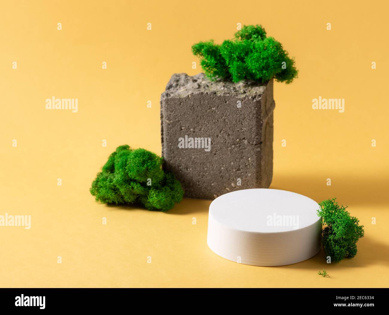 abstract composition with white podium, natural stone and moss Stock Photo