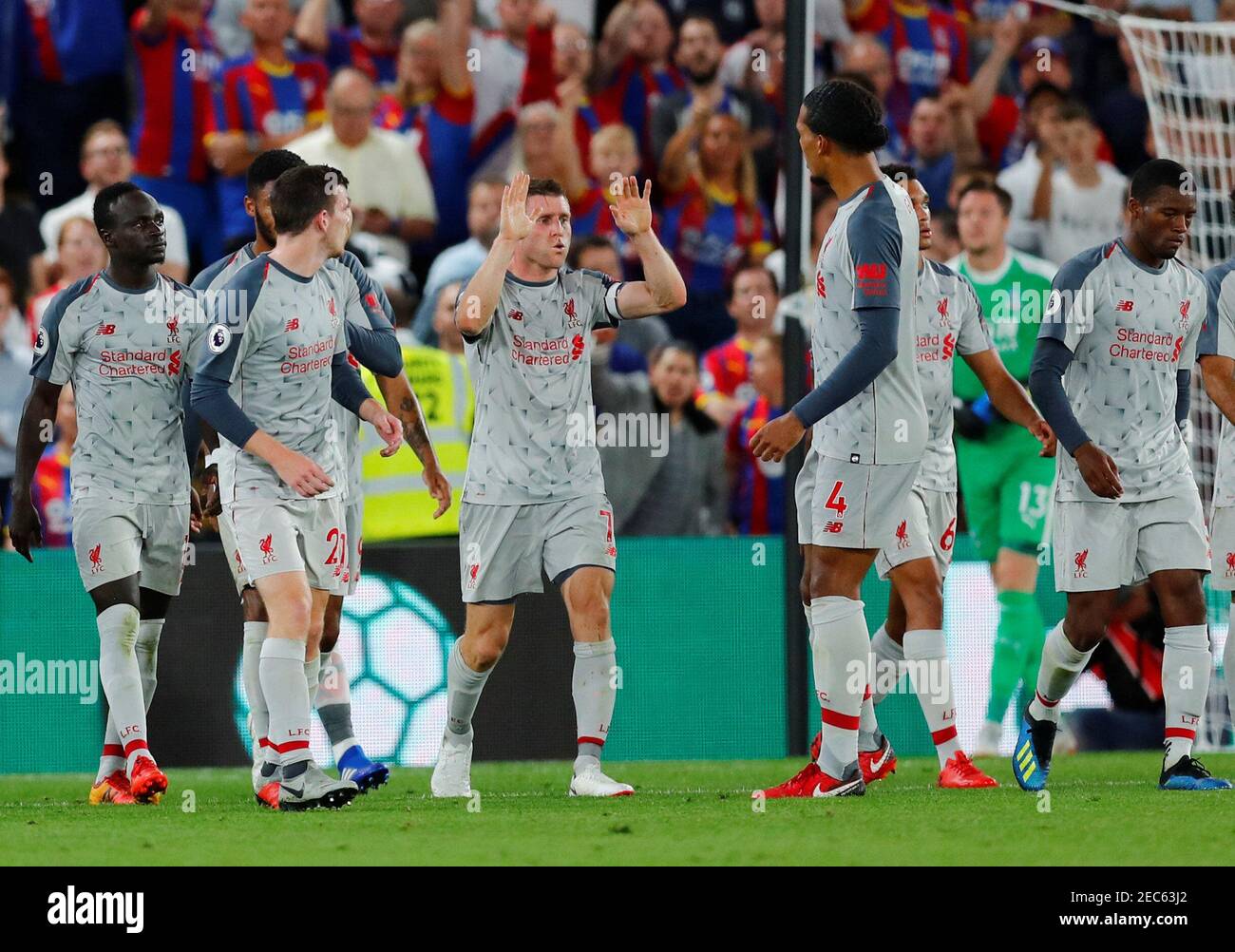 Soccer Football - Premier League - Crystal Palace v Liverpool - Selhurst Park, London, Britain - August 20, 2018 Liverpool's James Milner celebrates scoring their first goal from the penalty spot with team mates REUTERS/Eddie Keogh EDITORIAL USE ONLY. No use with unauthorized audio, video, data, fixture lists, club/league logos or "live" services. Online in-match use limited to 75 images, no video emulation. No use in betting, games or single club/league/player publications. Please contact your account representative for further details. Stock Photo