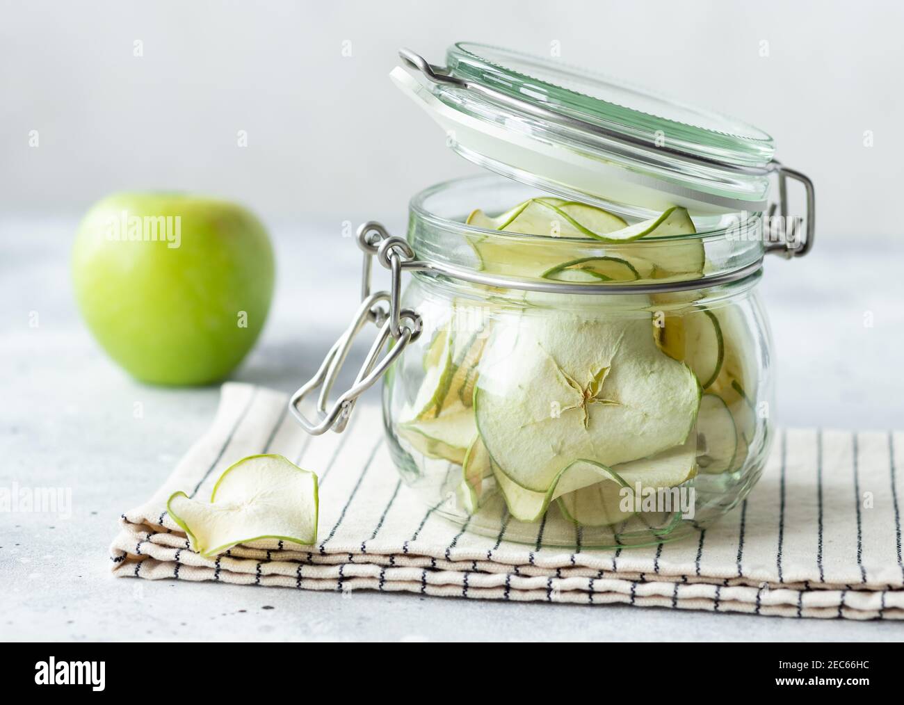 Dehydrated apple chips in glass jar Stock Photo Alamy