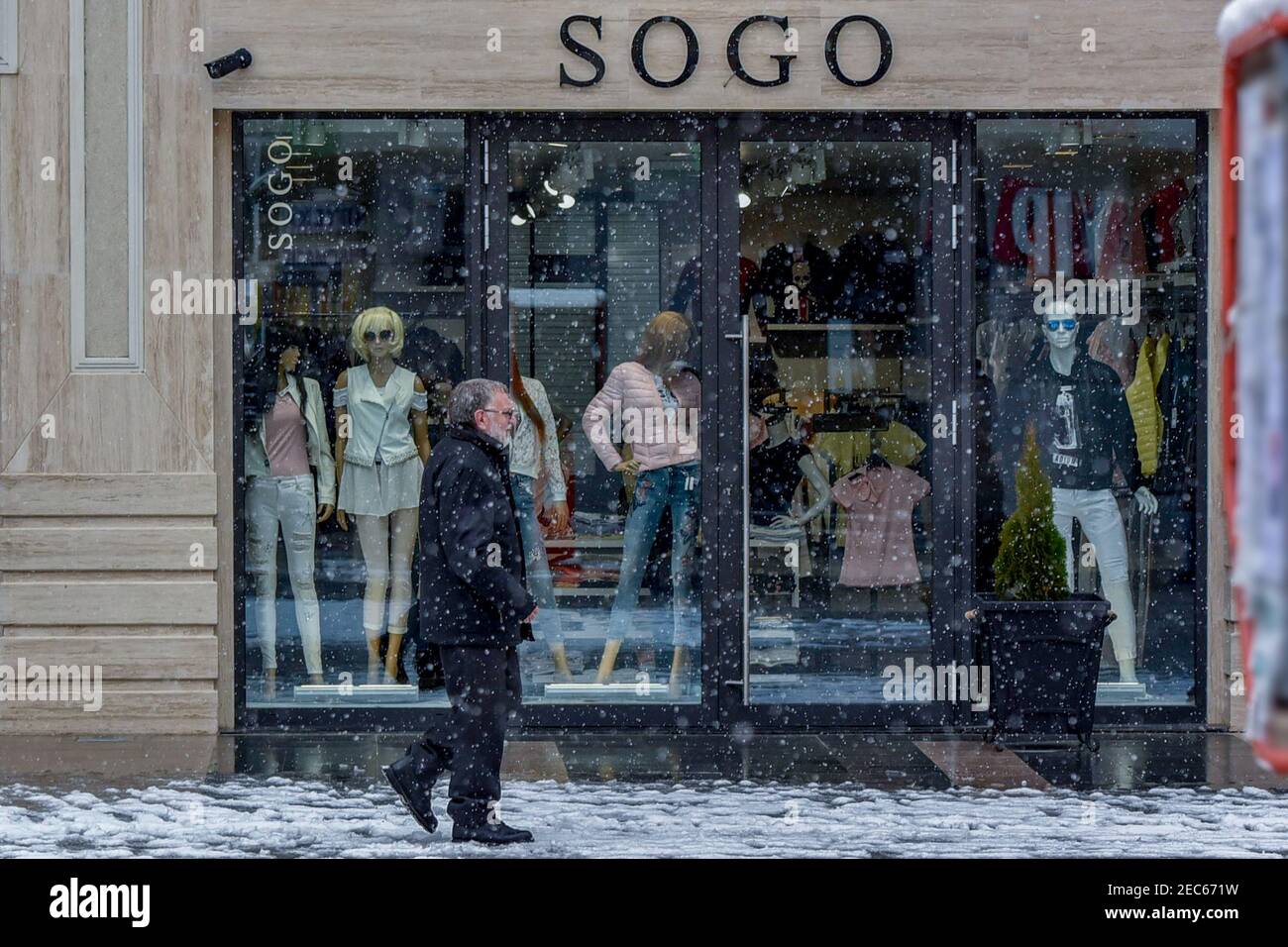 Sliven, Bulgaria - March 22nd 2018: Snow falling on a shopping high street Stock Photo