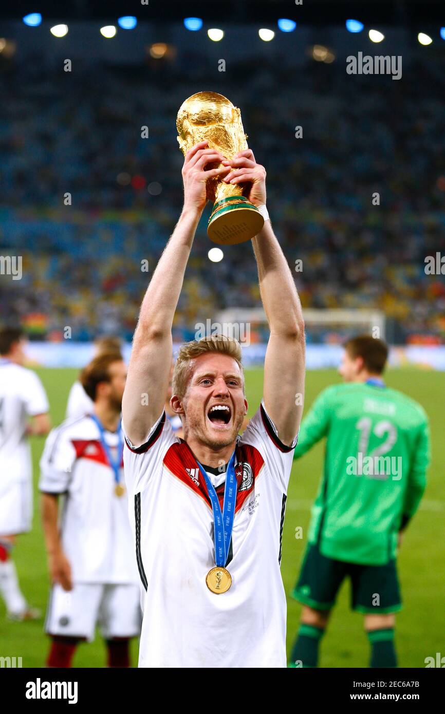 Germanys andre schurrle with the world cup trophy hires stock
