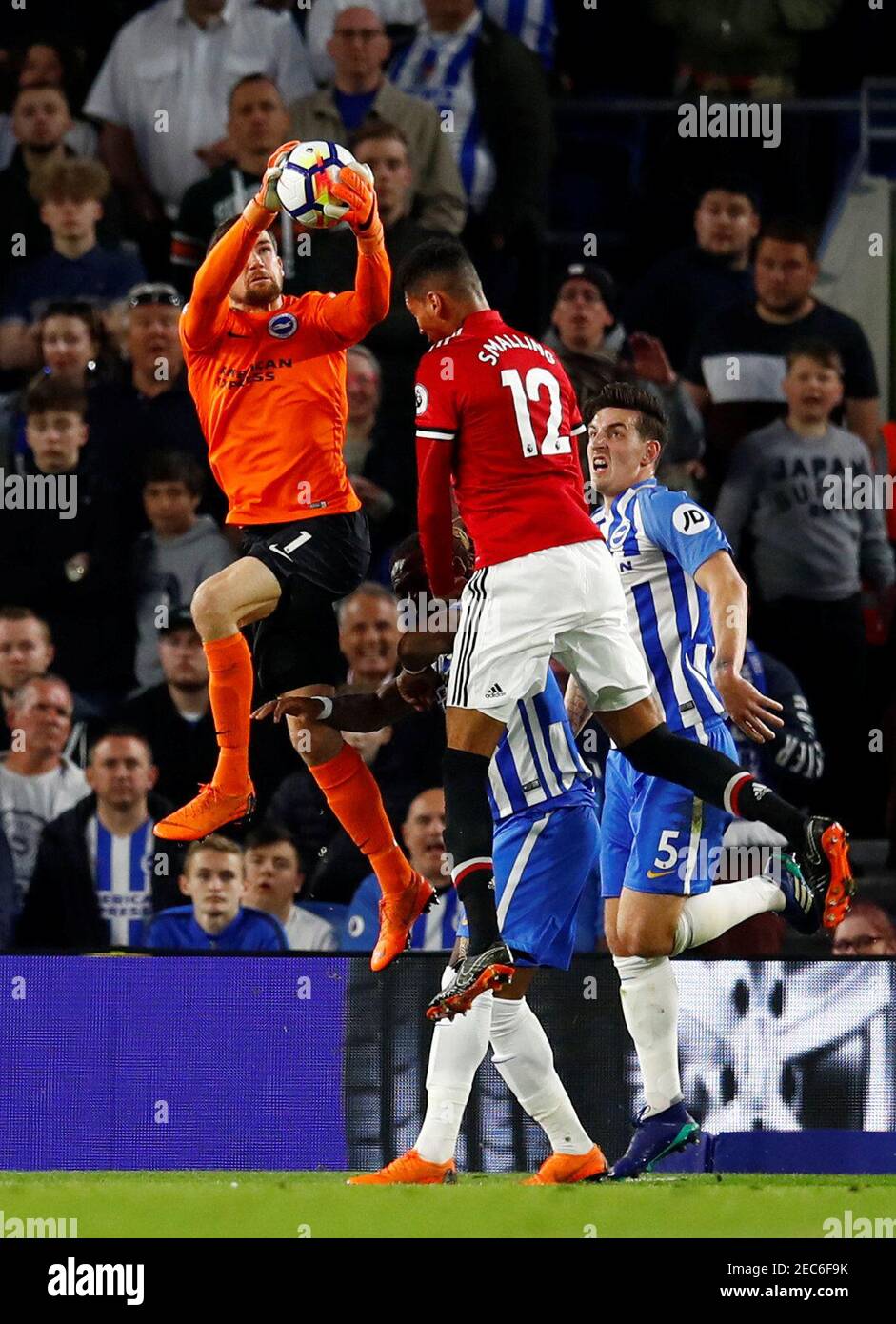 Soccer Football - Premier League - Brighton & Hove Albion v Manchester United - The American Express Community Stadium, Brighton, Britain - May 4, 2018   Brighton's Mathew Ryan gathers from Manchester United's Chris Smalling   REUTERS/Eddie Keogh    EDITORIAL USE ONLY. No use with unauthorized audio, video, data, fixture lists, club/league logos or 'live' services. Online in-match use limited to 75 images, no video emulation. No use in betting, games or single club/league/player publications.  Please contact your account representative for further details. Stock Photo