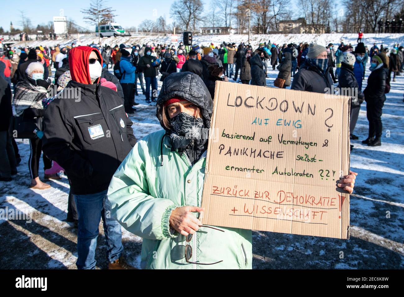 Rosenheim, Germany. 13th Feb, 2021. A demonstrator carries a sign reading 'Lockdown forever?' at a rally with the theme 'We're educating - against overreaching government Corona measures'. Based on conjecture & scare tactics of self-proclaimed autocrats??! Back to Democracy   Science!'. Credit: Matthias Balk/dpa/Alamy Live News Stock Photo