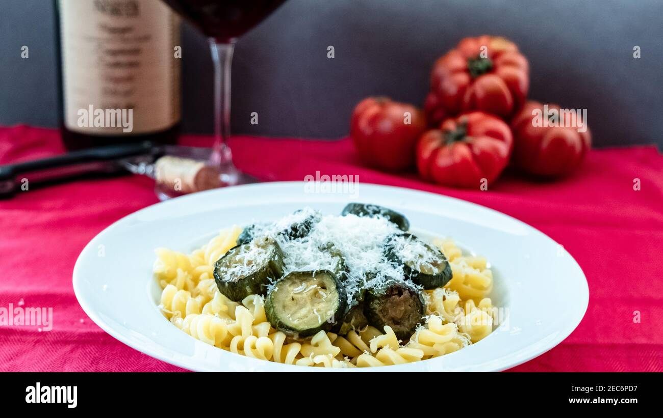 Pasta with zucchini on an italian table Stock Photo