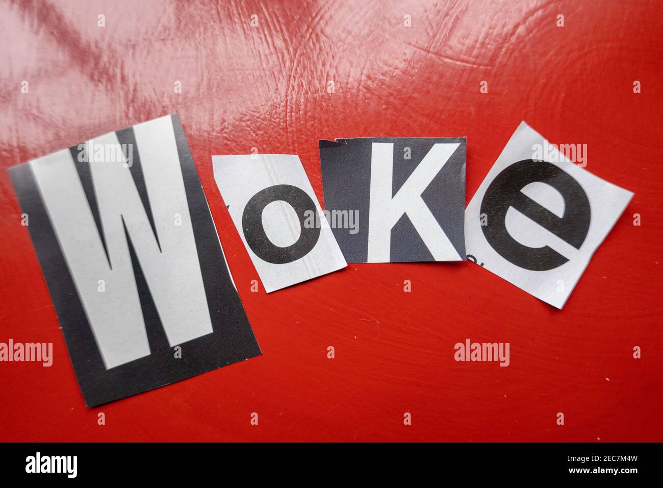 The word 'WOKE' using cut-out paper letters in the ransom note effect typography Stock Photo