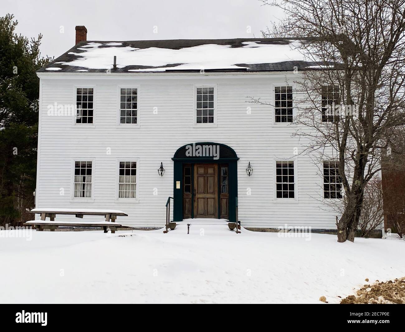 This photo of the Nathaniel Hawthorne Home in Raymond, Maine, was taken in February 2021. The historic house, pictured above, was built in around 1812 and is located in Southern Maine near Sebago Lake. It was occupied by the famous American writer, Nathaniel Hawthorne, from 1812 through around 1825. Some accounts attribute as little as one year of residence at this house, while others ascribe several years. The years 1821-1825 were Hawthorne’s years at Bowdoin College, and the Association assumes he remained connected to the house in Raymond during this time. The span of 1812-1825 describes th Stock Photo