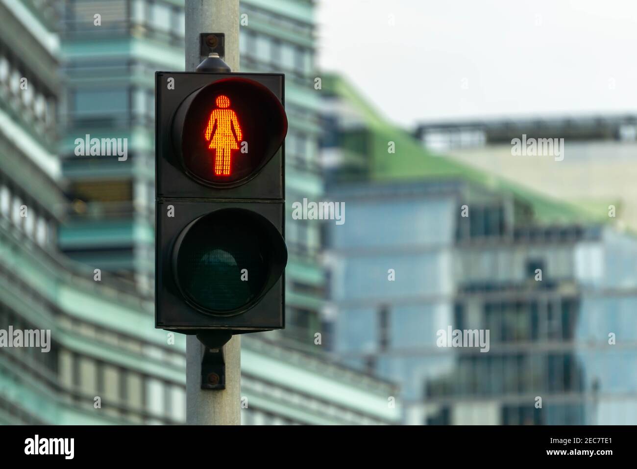 Red woman pedestrian signal. Many traffic lights with female figure shape are in one of avenue in Vilnius, Lithuania. Concept of equal rights and femi Stock Photo