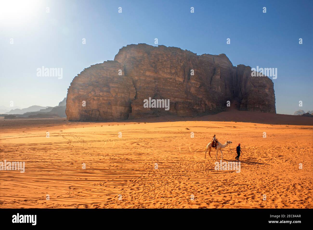 Tourists on a camel in the Wadi Rum desert Jordan Stock Photo