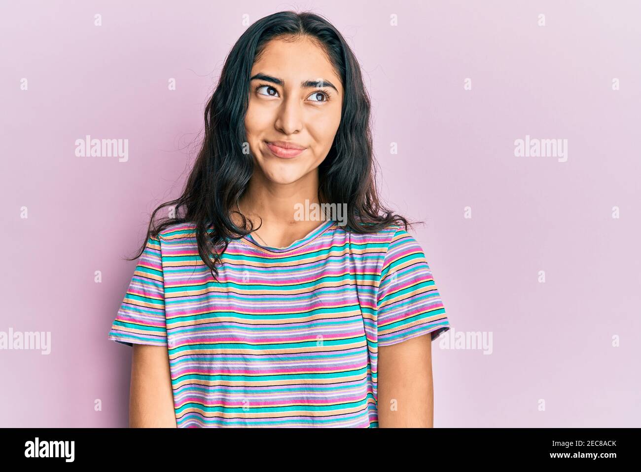 Hispanic teen girl thinking hi-res stock photography and images - Alamy