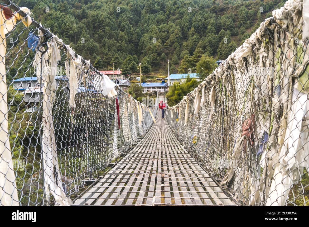 bridge over the river, solo trekker on the suspension bridge in Nepal