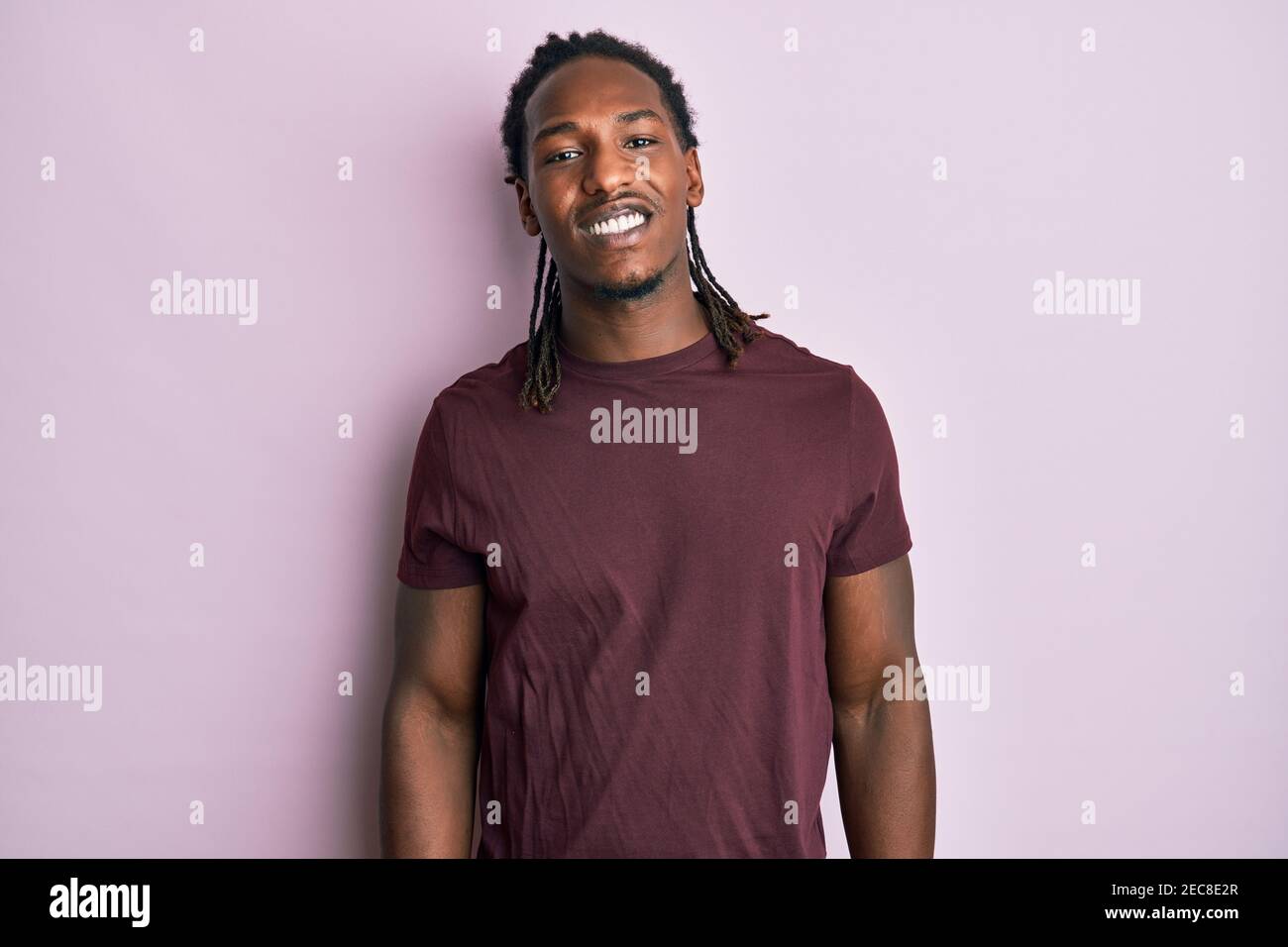 African american man with braids wearing casual clothes looking ...