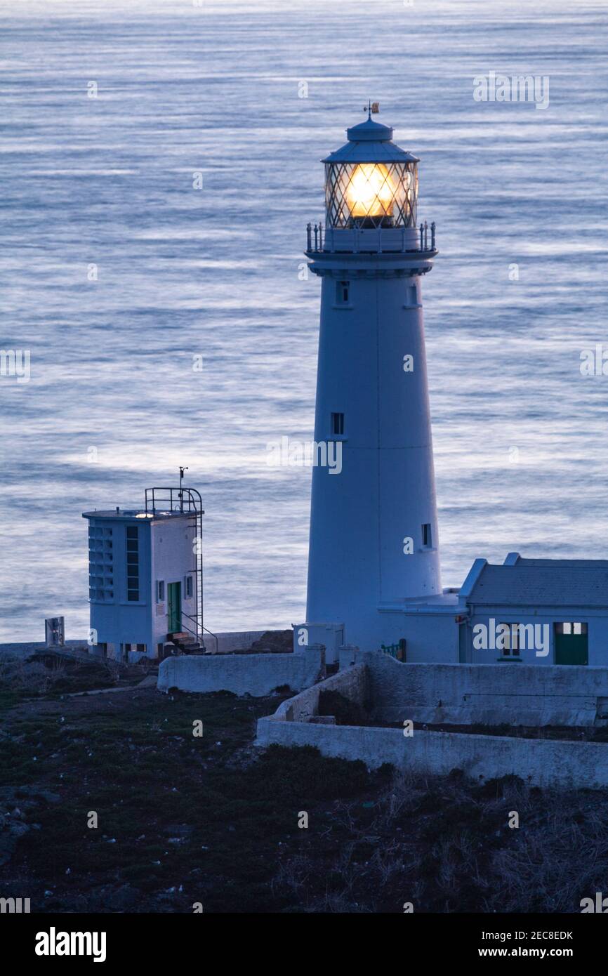 South Stack lighthouse at sunset, Anglesey on the North Wales coast Stock Photo