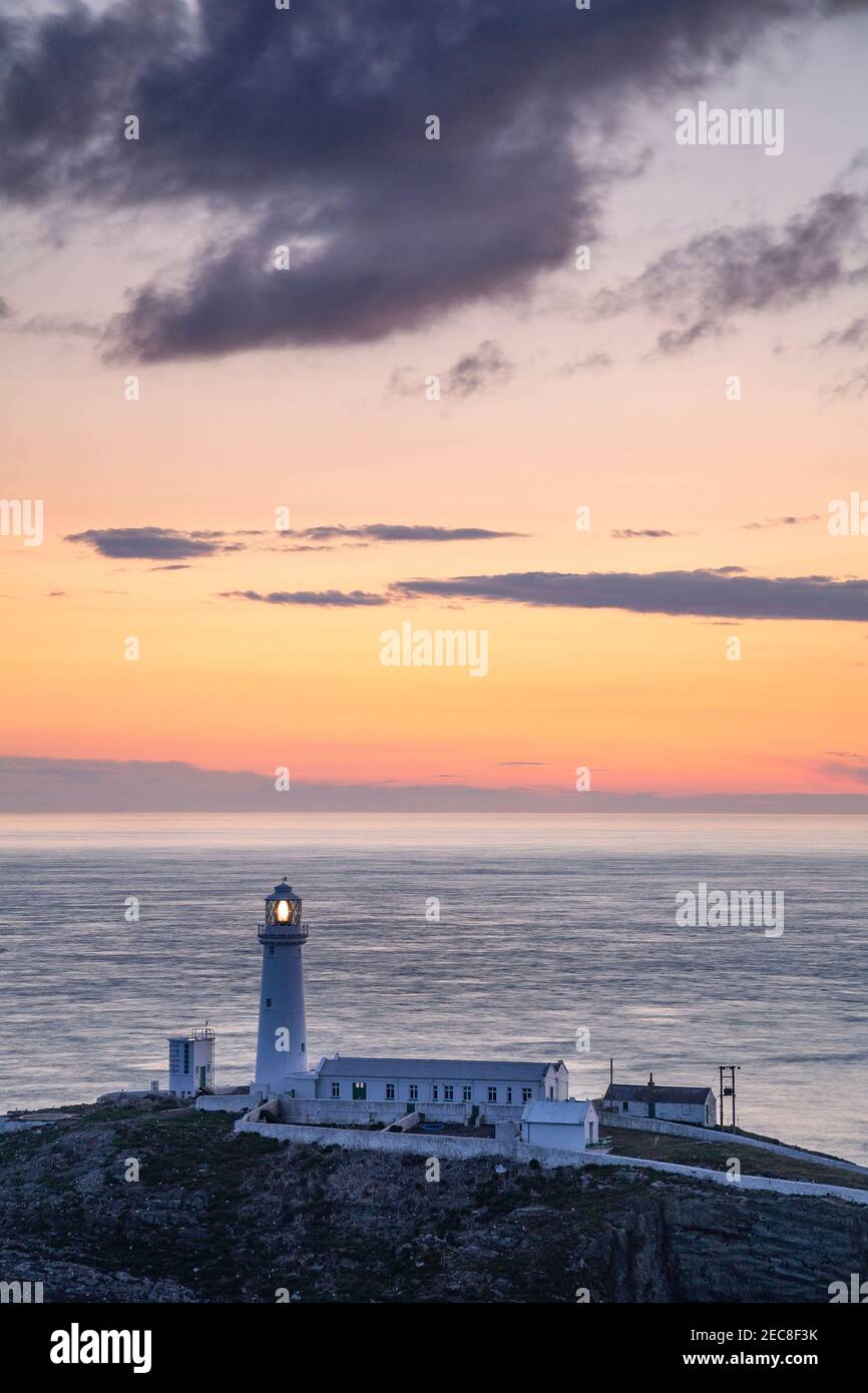 South Stack lighthouse at sunset, Anglesey on the North Wales coast Stock Photo