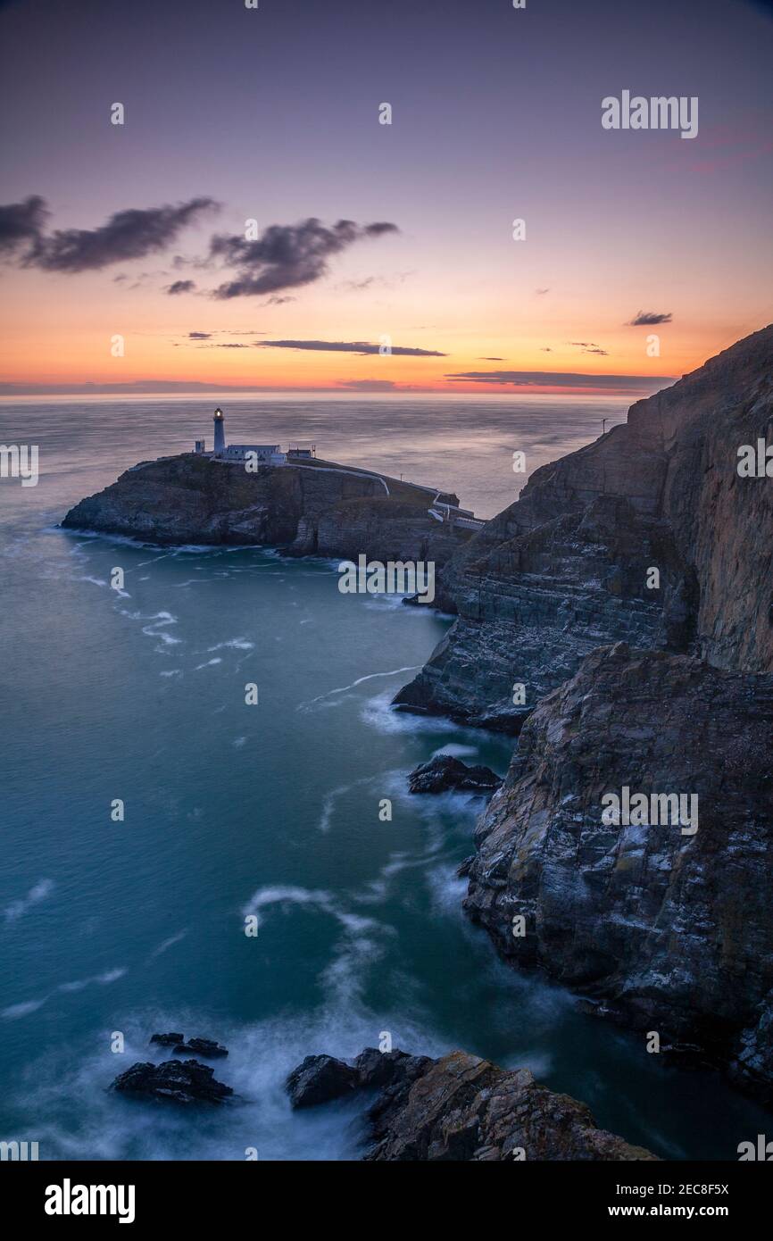 South Stack lighthouse at sunset, Anglesey on the North Wales coast Stock Photo
