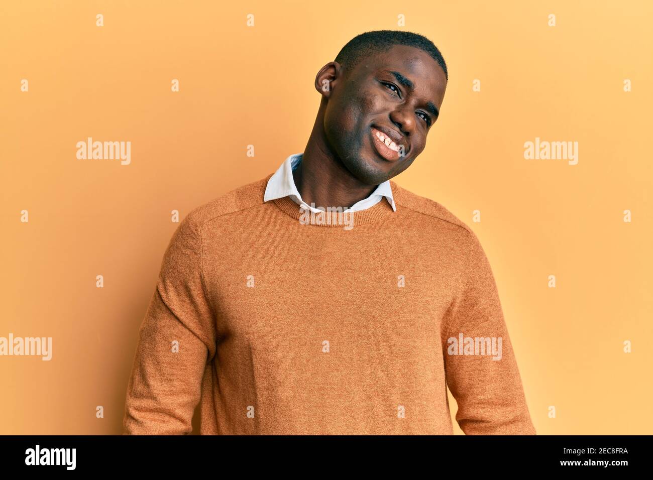 Young african american man wearing casual clothes looking away to side ...