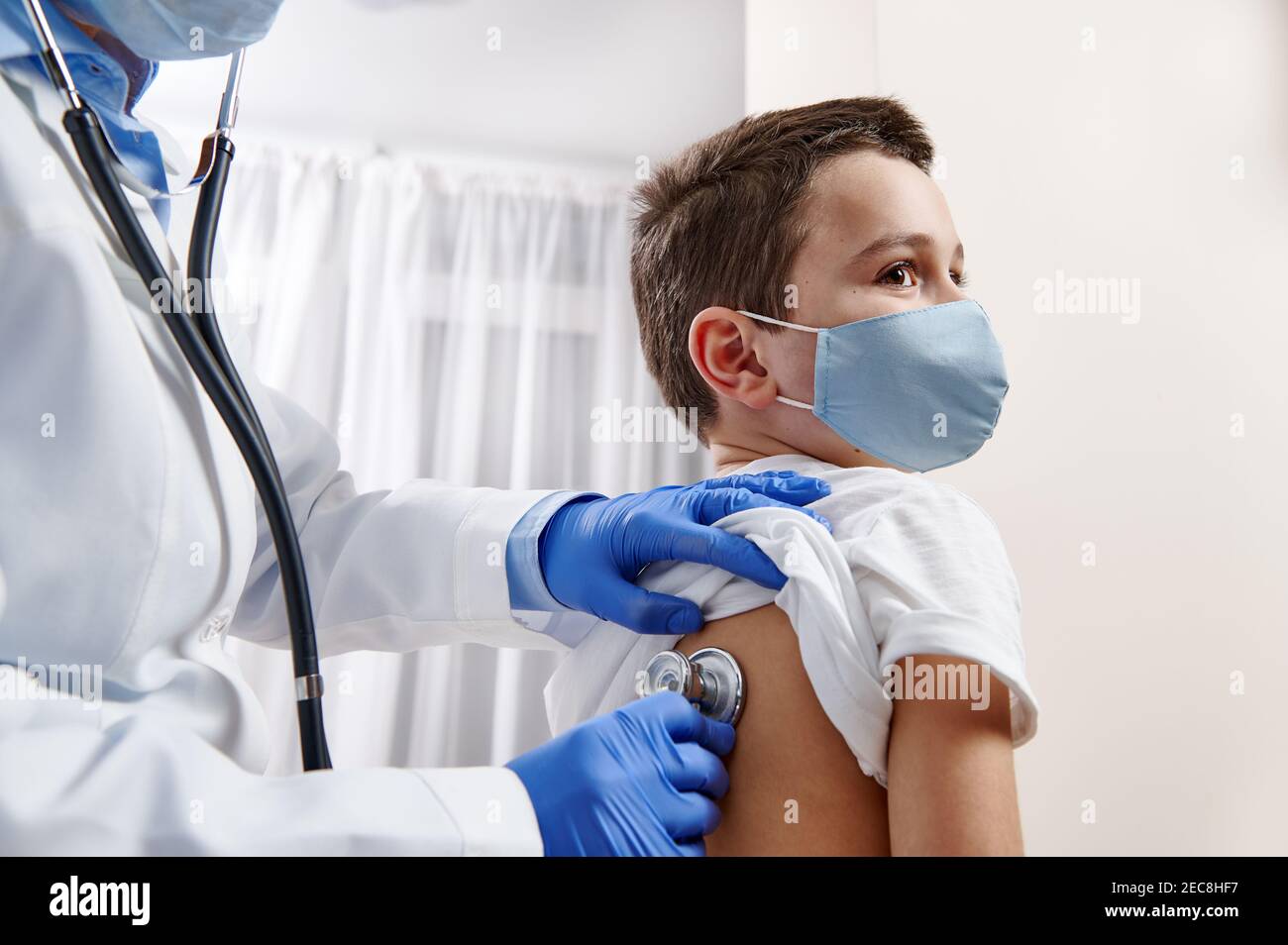 Female doctor pediatrician using stethoscope, checking up heartbeat and