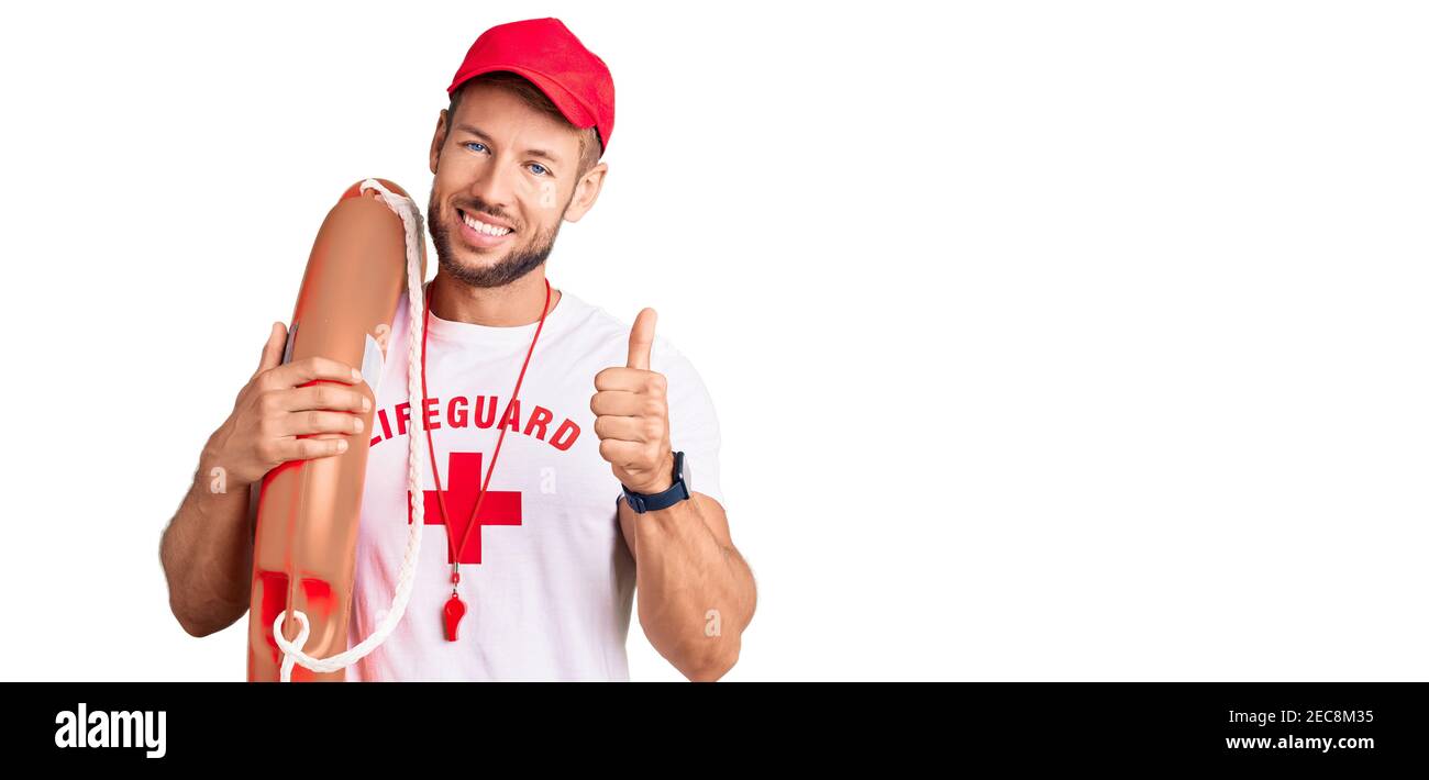 Young caucasian man wearing lifeguard t shirt holding float smiling ...