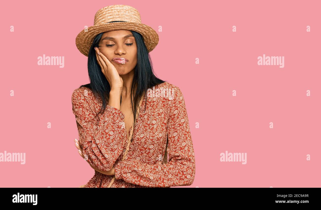 Thinking brunette african woman wearing hi-res stock photography and ...