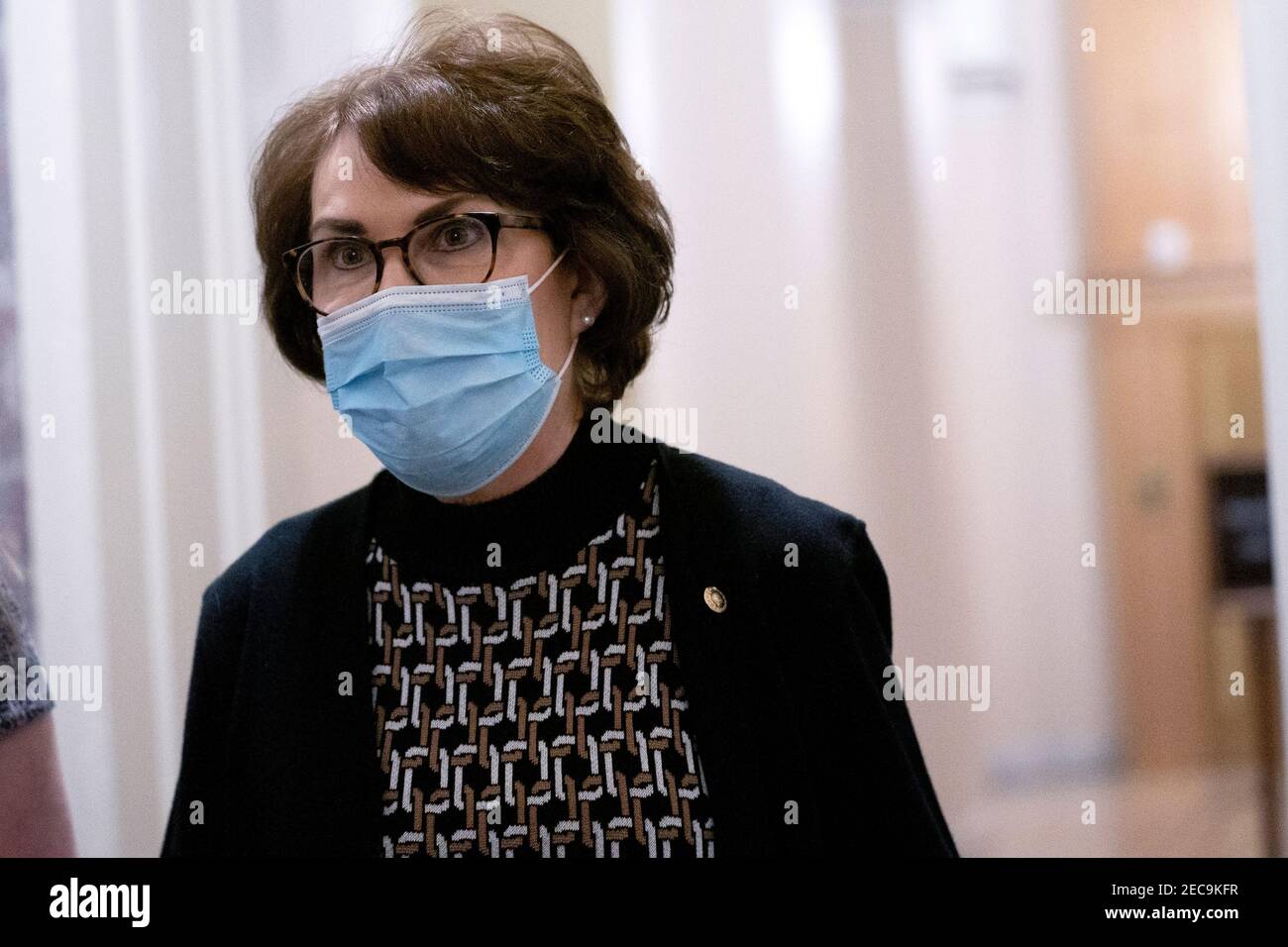Washington, DC, USA. 13th Feb, 2021. Senator Jacky Rosen, a Democrat from Nevada, wears a protective mask while walking through the U.S. Capitol in Washington, DC, U.S., on Saturday, Feb. 13, 2021. The Senate approved 55-45 a request to consider calling witnesses in the second impeachment trial of Donald Trump, a move that may extend the trial that was expected to end within hours. Credit: Stefani Reynolds - Pool via CNP | usage worldwide Credit: dpa/Alamy Live News Stock Photo