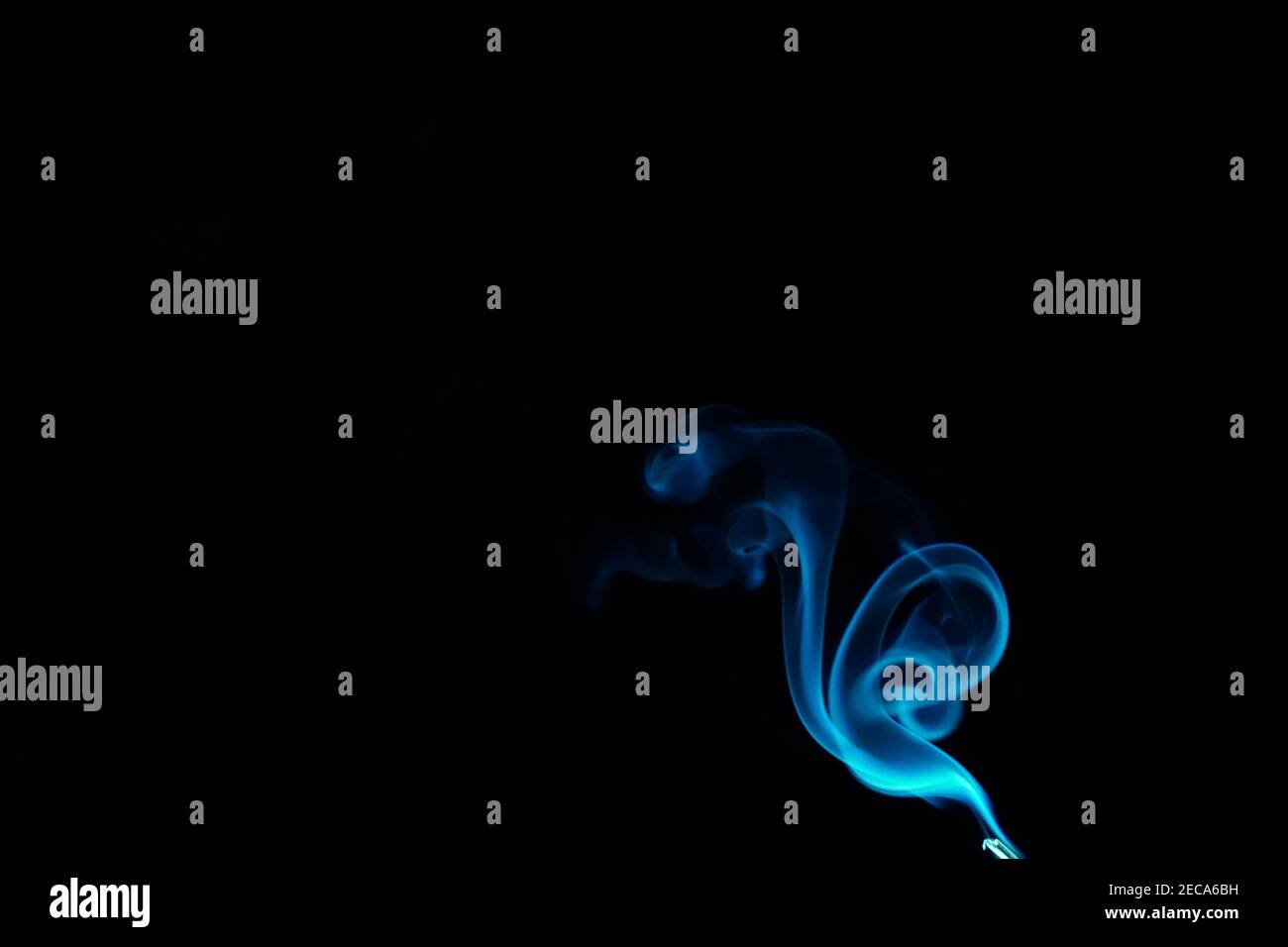 Cloud of abstract blue smoke in front of a black background Stock Photo ...