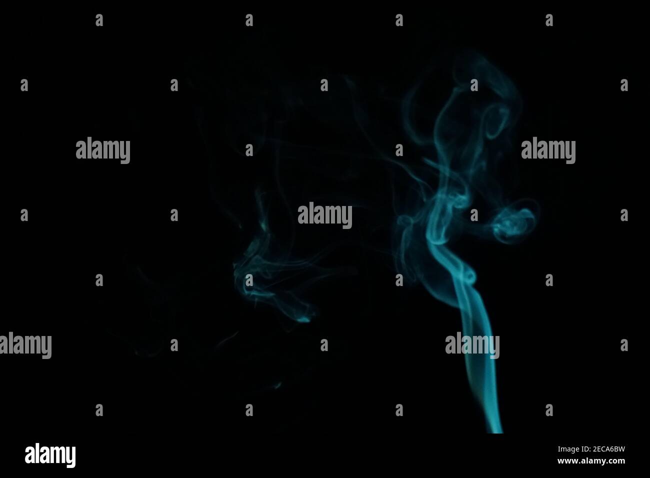 Cloud of abstract blue smoke in front of a black background Stock Photo ...