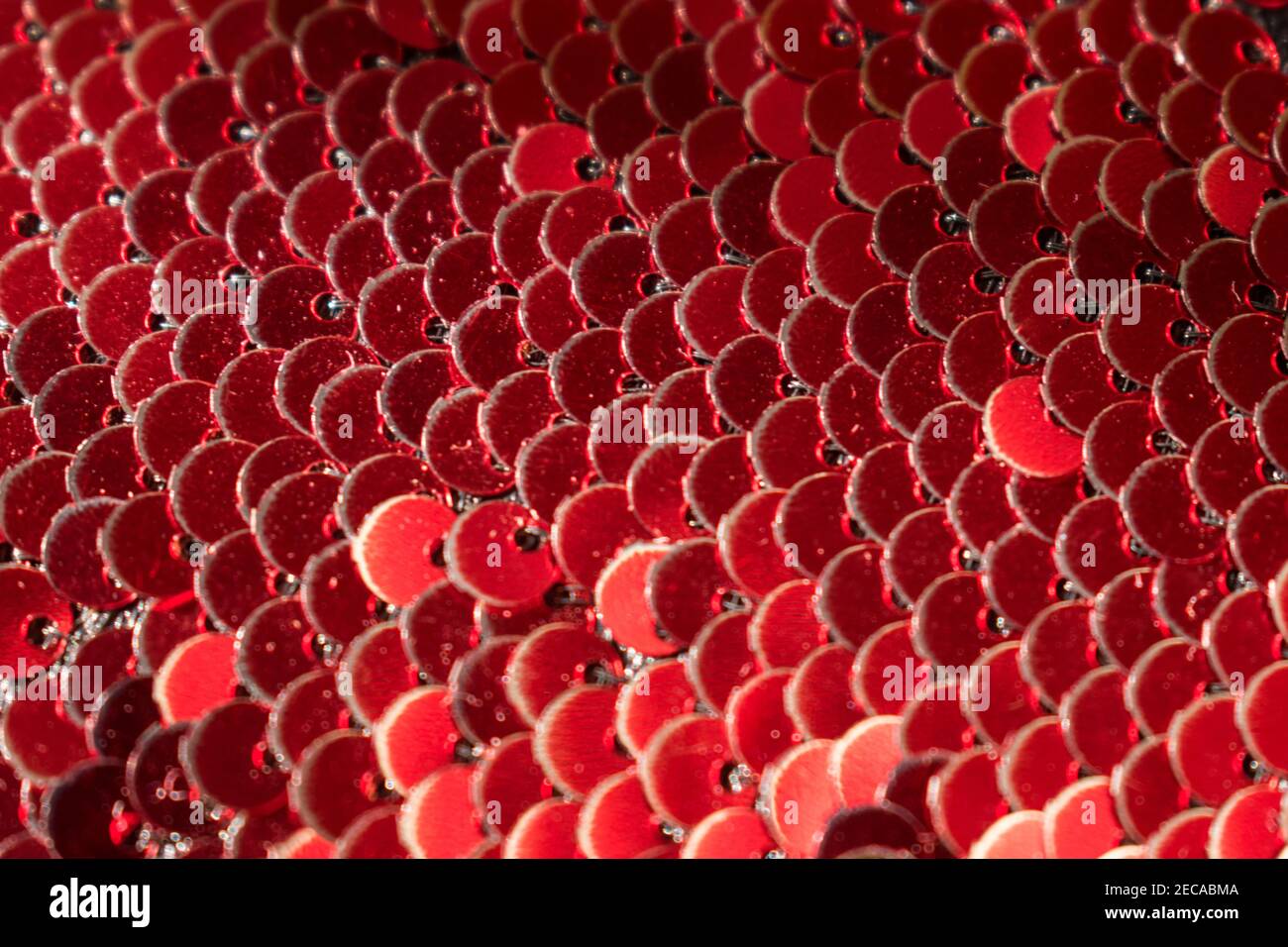 Macro of bright red sequins in a pattern Stock Photo