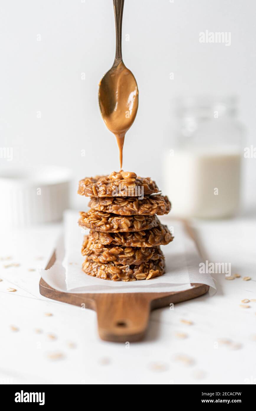 Morning Breakfast Energy Biscuit Cookies With Oats and Peanut Butter, Served with Dairy Milk Stock Photo