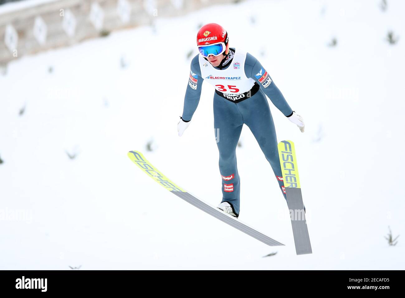 Zakopane, Poland. 13th Feb, 2021. Philipp Aschenwald ski jumping on The Great Krokiew Ski Jumping facility during the Ski Jumping World Cup competition in Zakopane. Credit: SOPA Images Limited/Alamy Live News Stock Photo