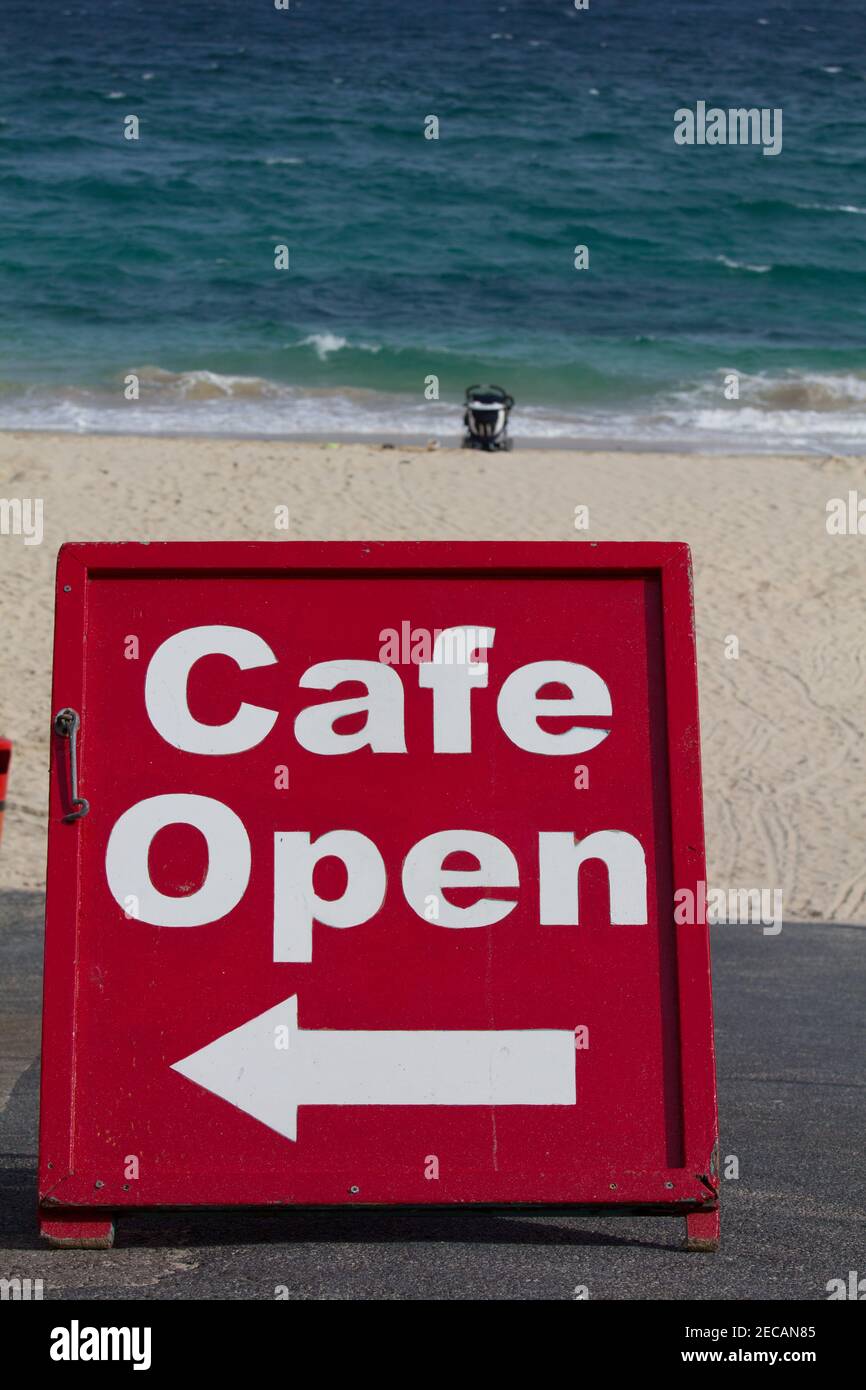 A café sign at Porthgwidden beach, St Ives, Cornwall.  Covid pandemic closures and concept pointing to lifting of lockdown for hospitality. Stock Photo