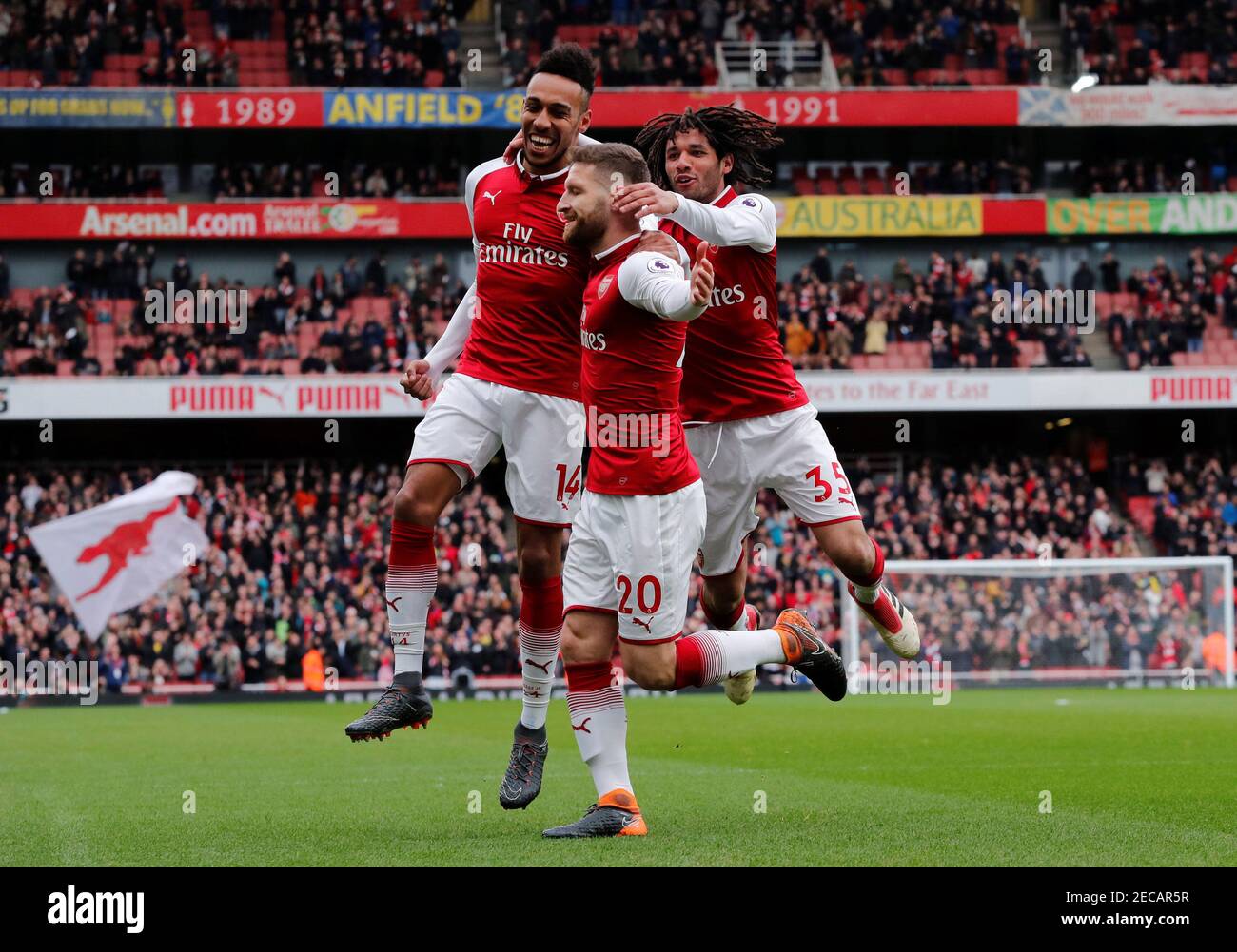 Soccer Football - Premier League - Arsenal vs Watford - Emirates Stadium, London, Britain - March 11, 2018 Arsenal's Shkodran Mustafi celebrates scoring their first goal with team mates REUTERS/Eddie Keogh EDITORIAL USE ONLY. No use with unauthorized audio, video, data, fixture lists, club/league logos or "live" services. Online in-match use limited to 75 images, no video emulation. No use in betting, games or single club/league/player publications. Please contact your account representative for further details. Stock Photo