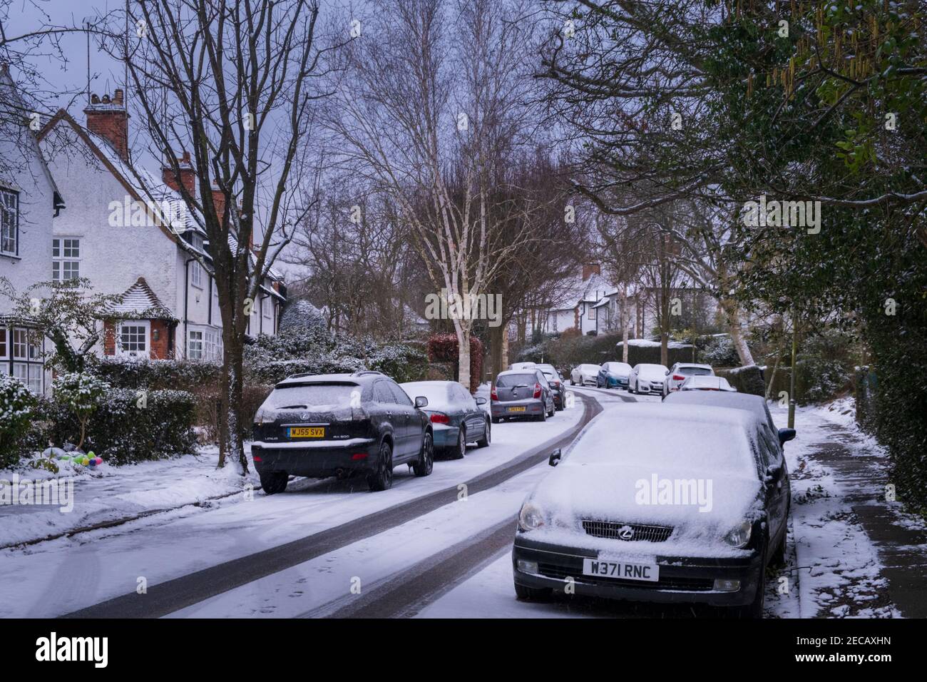 A snowy street in Hampstead Garden Suburb, arts and crafts houses, real estate, Oakwood Road, Barnet, London, UK Stock Photo