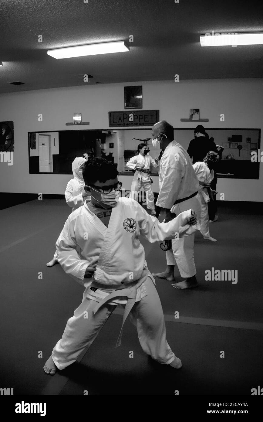 This action photo is of my son and his classmates in a Karate class. Karate is a physically and mentally challenging sport that builds agility. Stock Photo