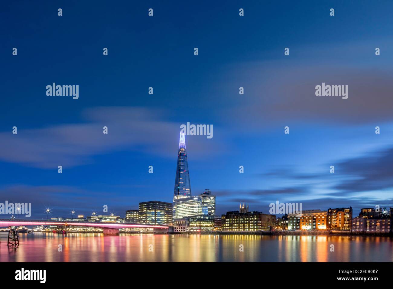 UK, London, Southwark, view of London Bridge (illuminated), Thames, the Shard skyscraper and the skyline of the south bank of the river in Southwark Stock Photo