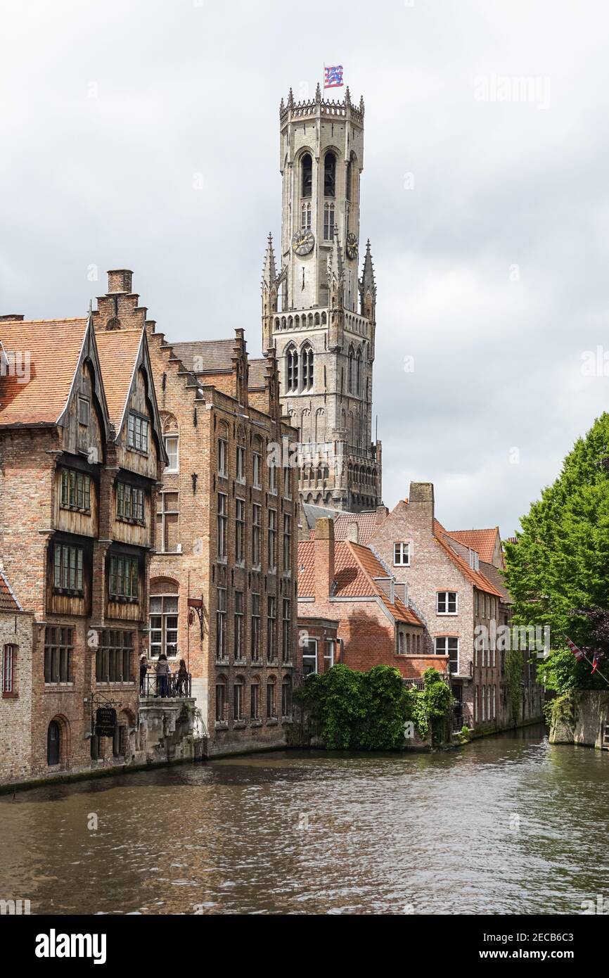 Medieval buildings on the Dijver canal with the Belfry bell tower seen from Rozenhoedkaai in Bruges, Belgium Stock Photo