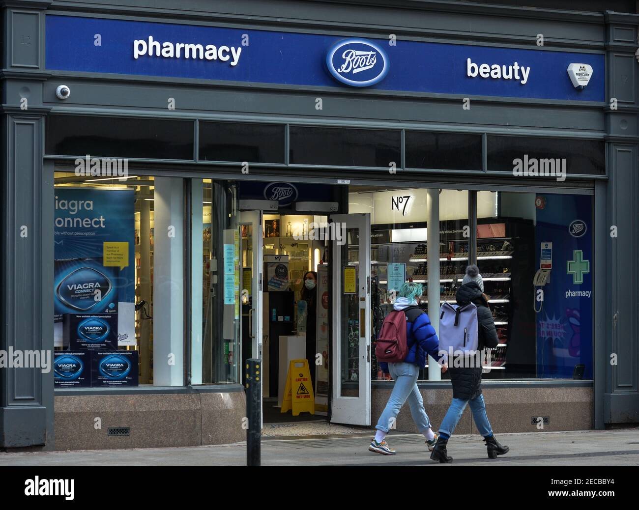 People walk by Boots Pharmacy on Grafton Street in Dublin city center,  during the COVID-19 pandemic lockdown.Level 5 lockdown restrictions are set  to be extended by Irish Government, by at least another