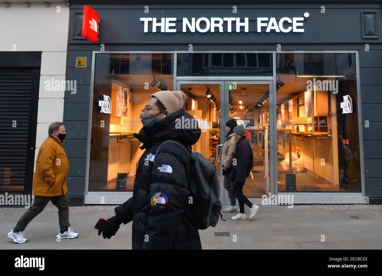 People walking by a closed The North Face store on Grafton Street in Dublin  city center, during the COVID-19 pandemic lockdown.Level 5 lockdown  restrictions are set to be extended by Irish Government,
