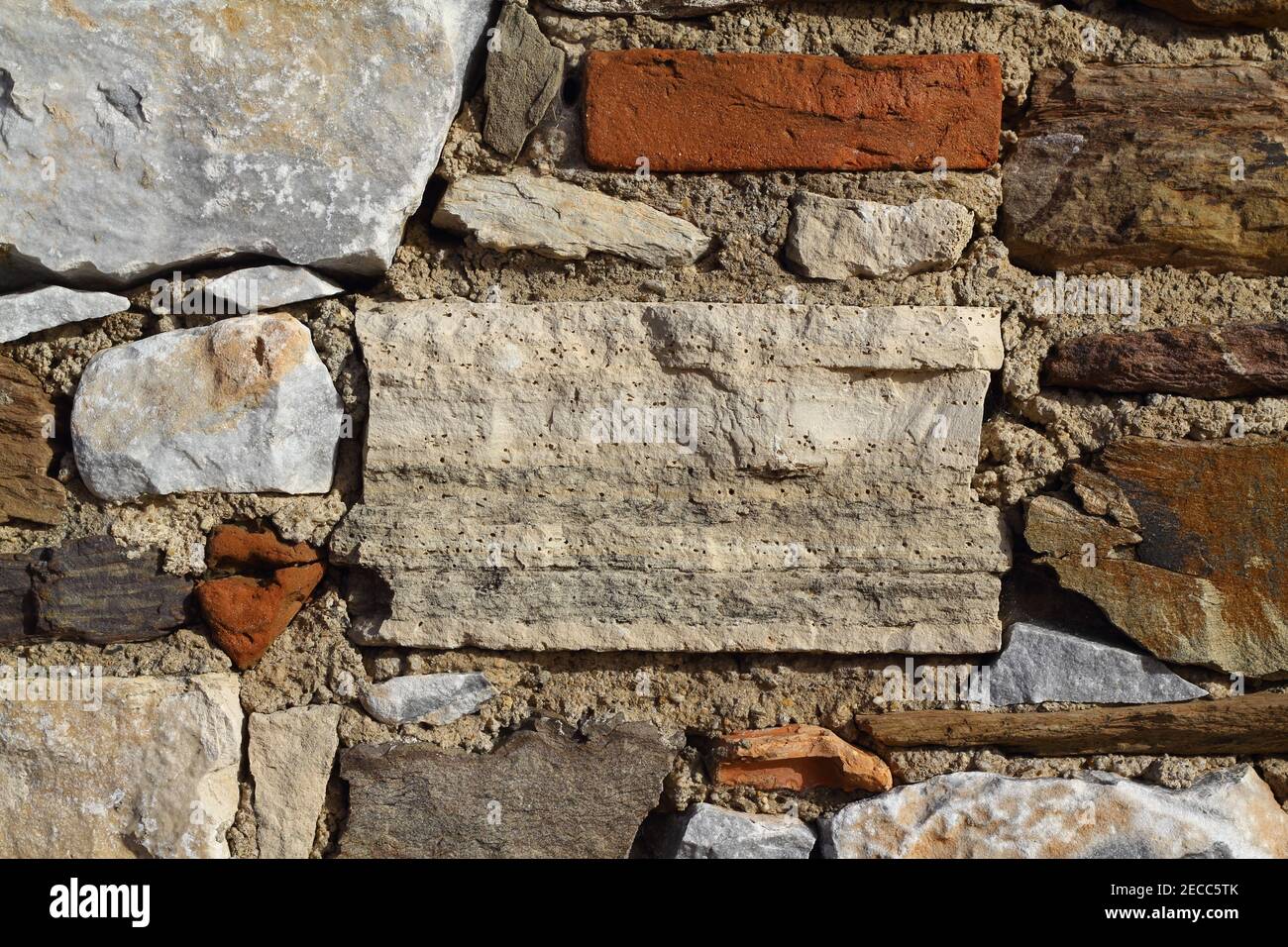 old stone masonry wall texture background, banner with irregular pattern Stock Photo