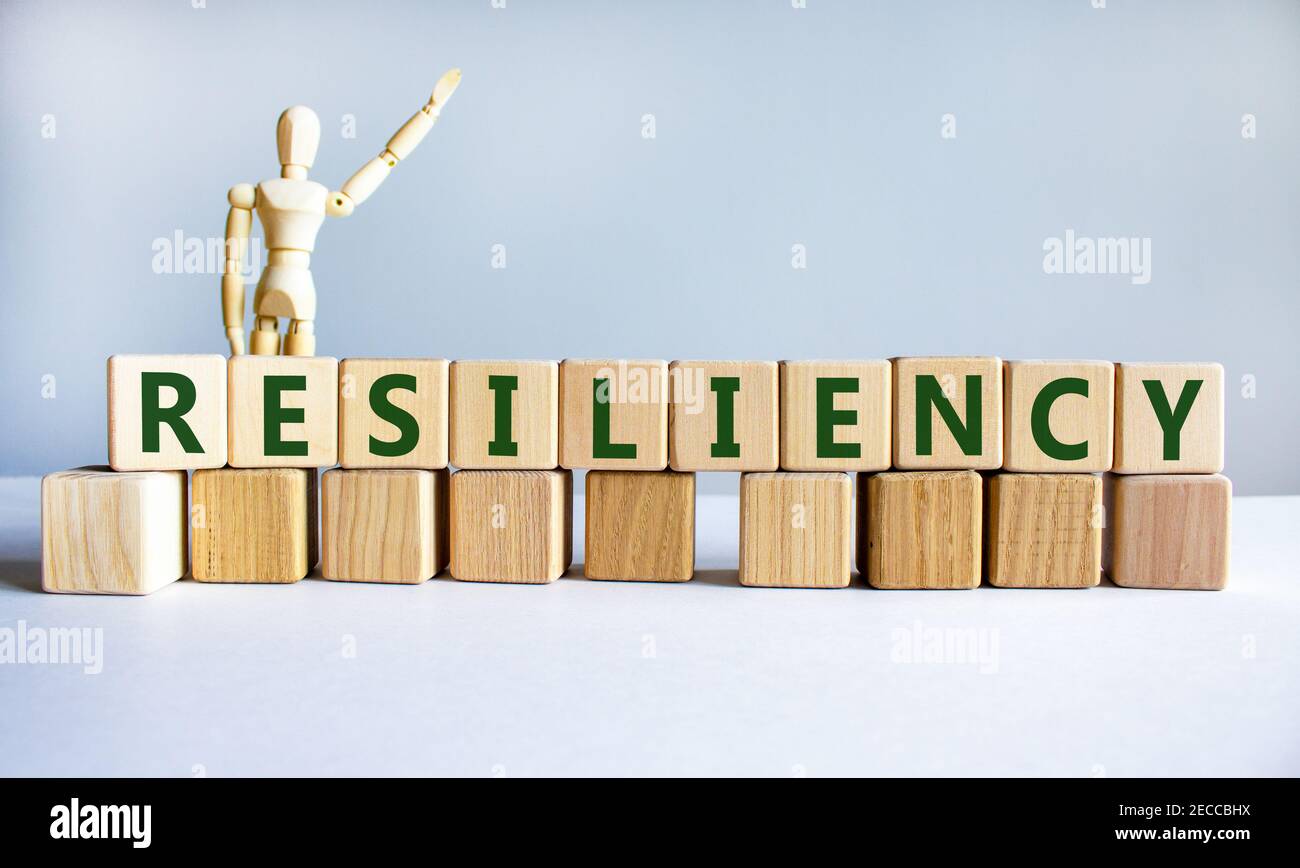 Resiliency symbol. Word 'Resiliency' written on wooden blocks. Wooden ...