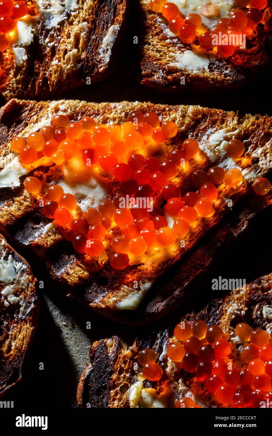 rye bread toast with butter and red salmon caviar Stock Photo Alamy