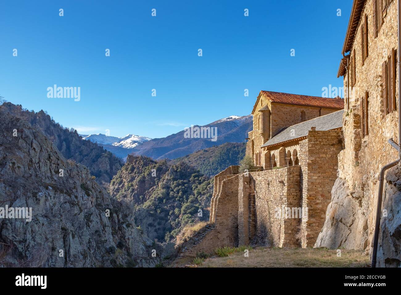 View on the Pyrenean mountains covered with snow from the Abbey of Saint-Martin-du-Canigou located in southern France Stock Photo