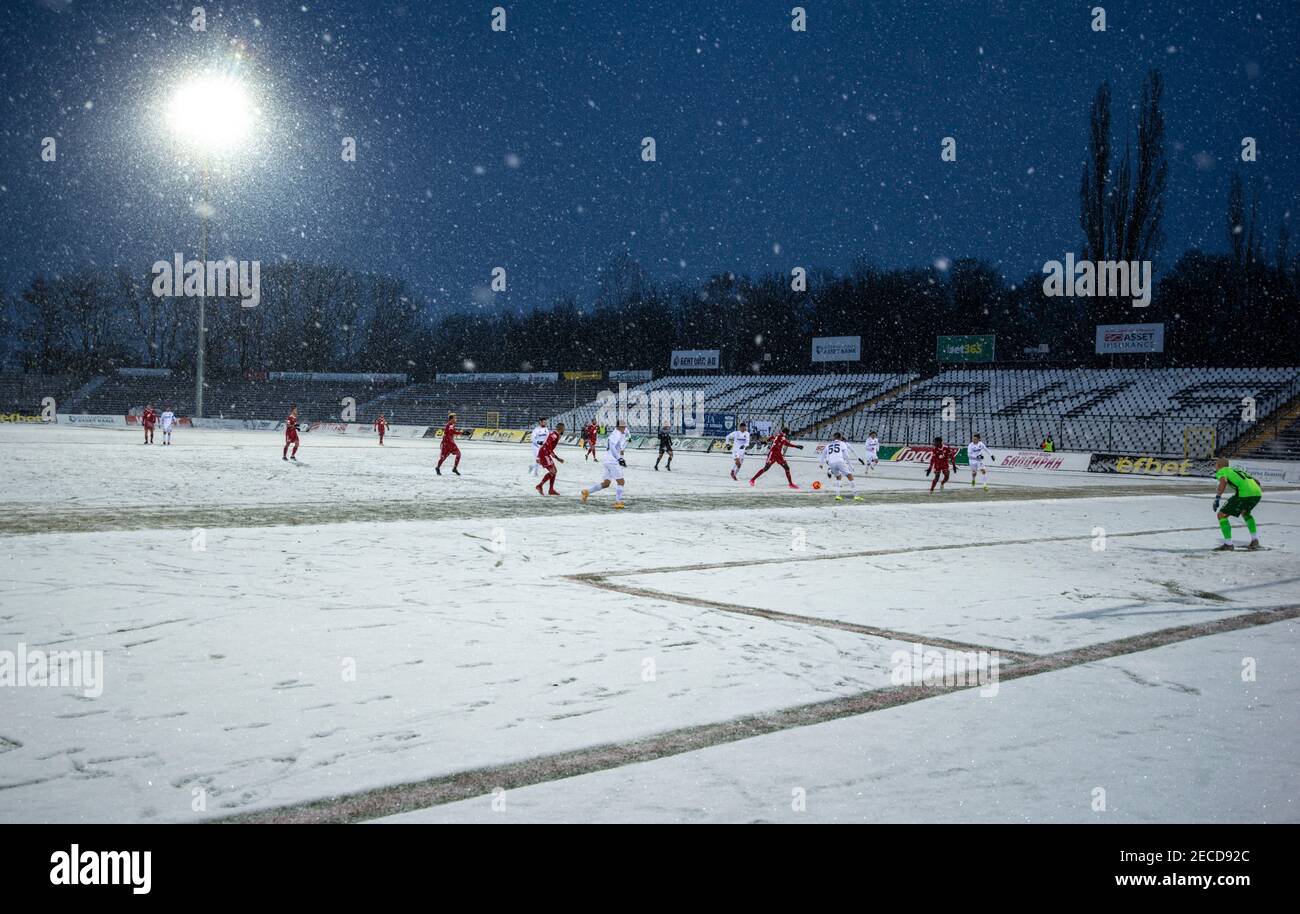 Sofia, Bulgaria - Feb 13 2021: Slavia and CSKA Sofia playing on the snowy Slavia stadium Stock Photo