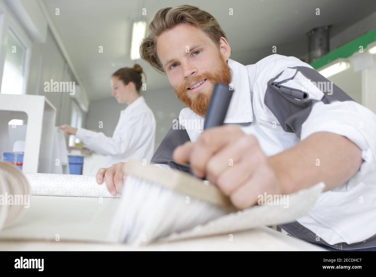 contractor worker preparing for wallpaper decoration Stock Photo