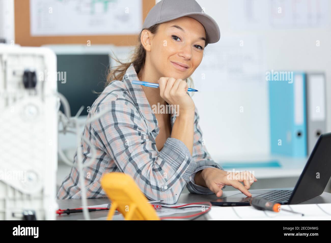 female computer technician using a laptop Stock Photo