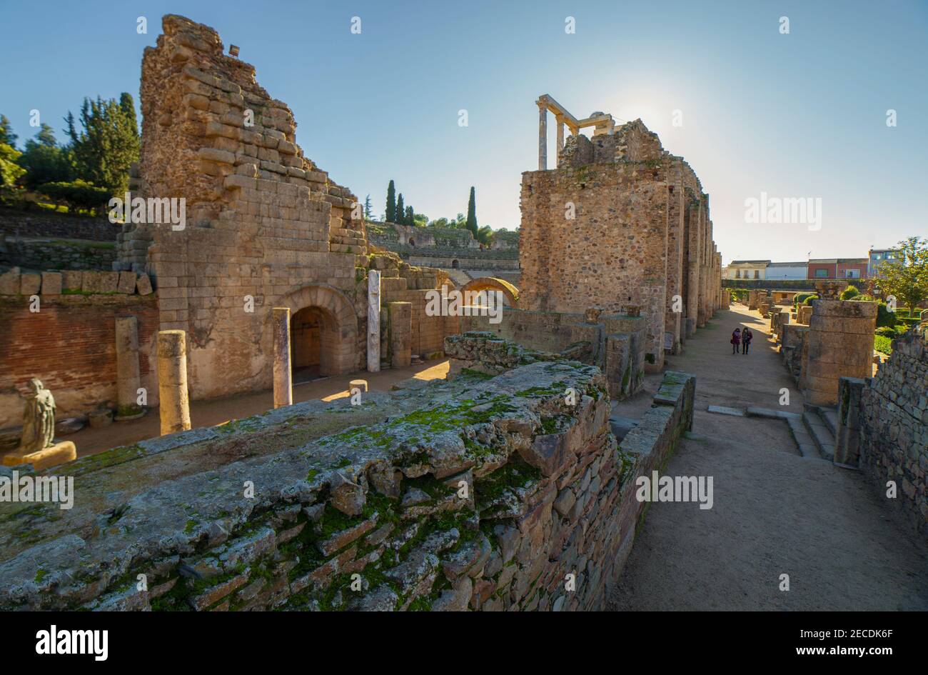 Visitors walking by perystile of Merida Roman theatre. One of the largest and most extensive archaeological sites in Europe. West access. Extremadura, Stock Photo