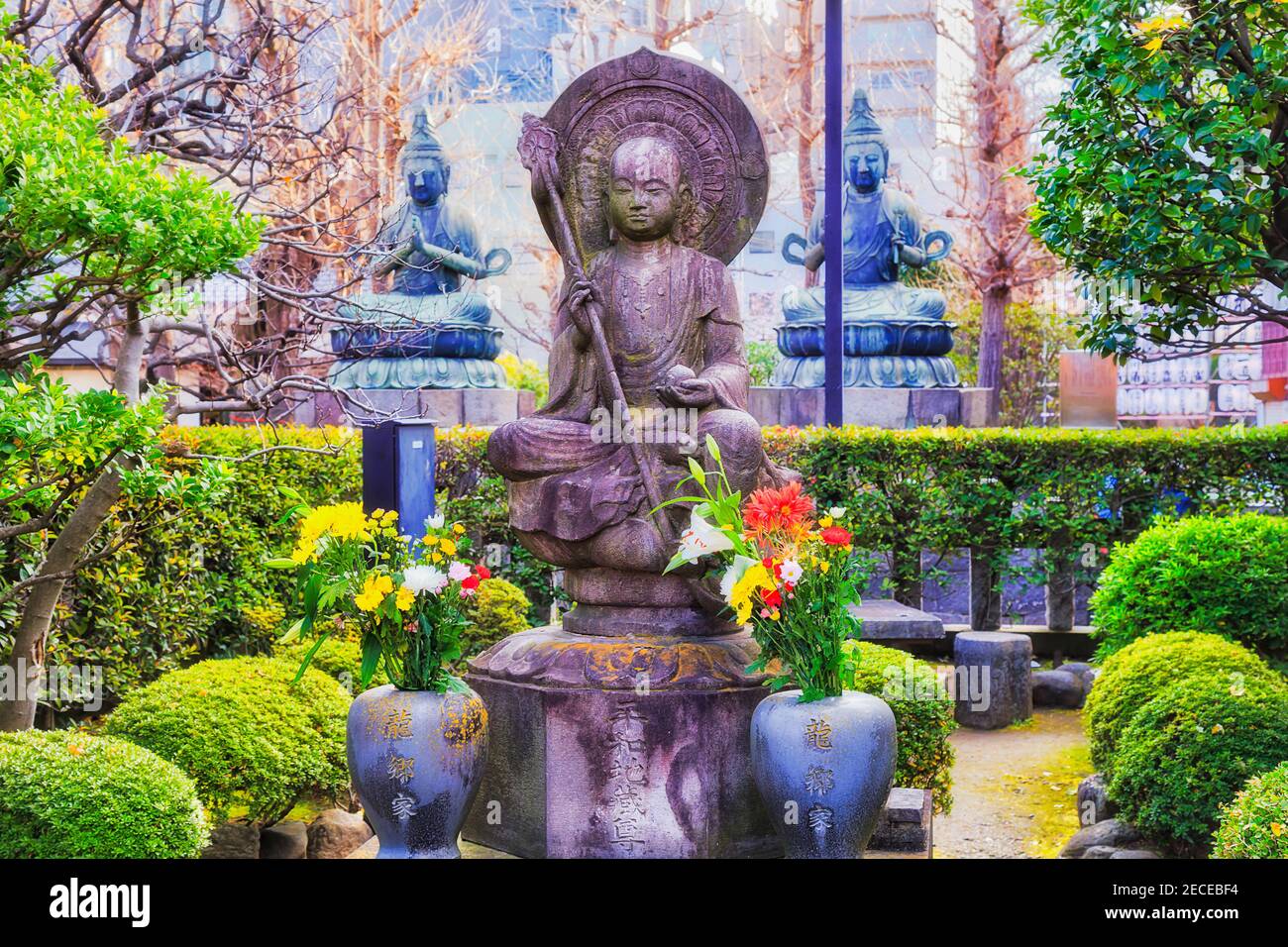 The statues of Buddha, saints and gods at small green park near Senso-Ji temple of Asakusa, Tokyo, Japan. Stock Photo
