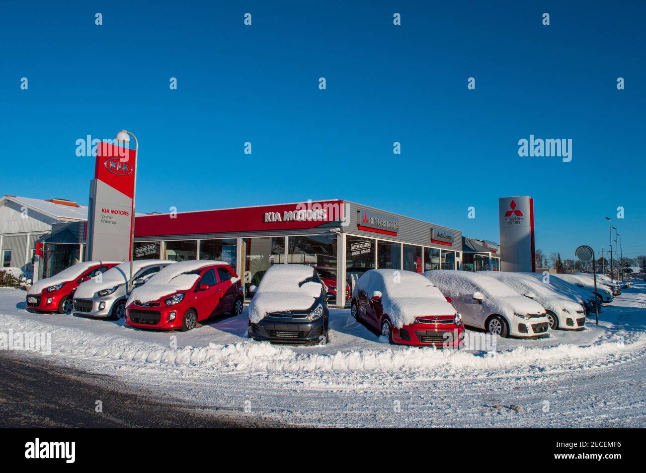 Vordingborg Denmark - Januar 17. 2016: KIA and Mitsubishi automobile dealership on a snowy day Stock Photo