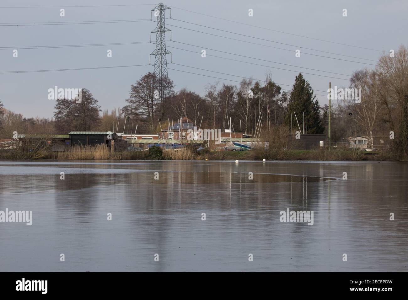 Harefield, UK. 13th February, 2021. Ice is pictured on the surface of HOAC lake in the Colne Valley. The current cold spell is expected to be replaced by milder conditions after tomorrow. Credit: Mark Kerrison/Alamy Live News Stock Photo