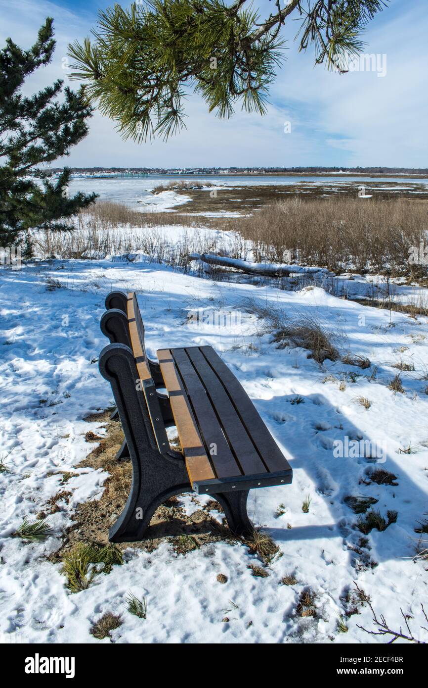 A bench in winter, Salisbury Massachusetts Stock Photo
